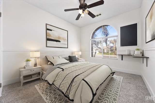 bedroom with light carpet and ceiling fan