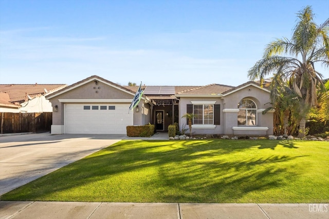 ranch-style home with a garage, a front lawn, and solar panels