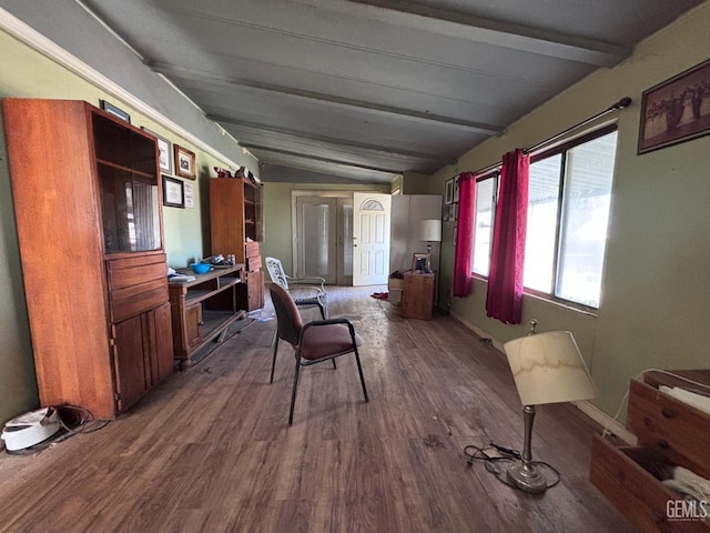 interior space featuring lofted ceiling with beams and hardwood / wood-style flooring