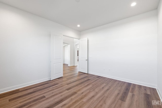 empty room with dark wood-type flooring