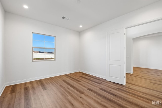 spare room featuring hardwood / wood-style floors