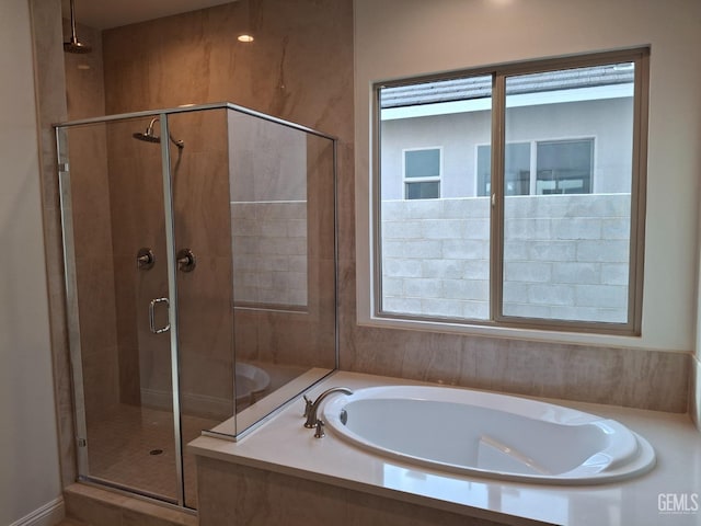 bathroom featuring plus walk in shower