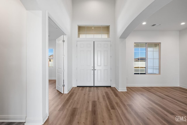 foyer entrance with light wood-type flooring