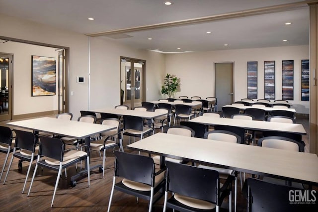 dining space featuring dark wood-type flooring and recessed lighting