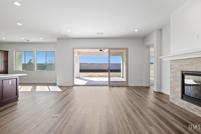 unfurnished living room with light hardwood / wood-style flooring