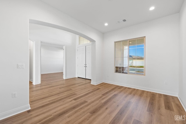 unfurnished room with light hardwood / wood-style flooring