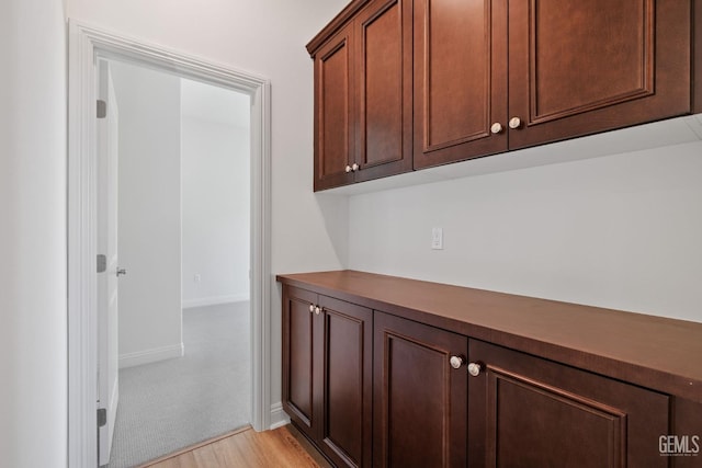 hall with light hardwood / wood-style flooring