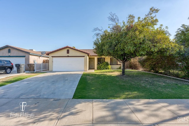 view of front of home featuring a garage and a front lawn