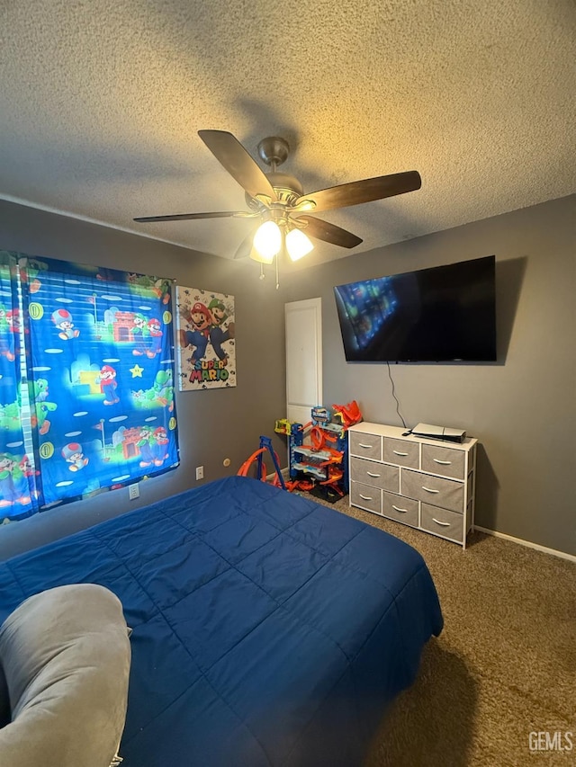 carpeted bedroom with a textured ceiling and a ceiling fan