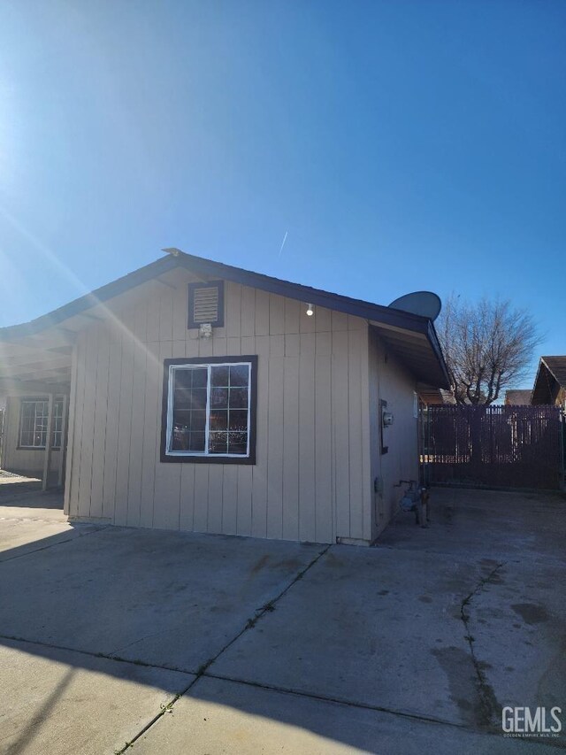 view of front of house with a yard and a carport