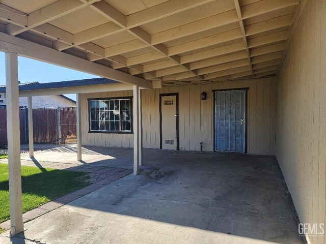 view of parking / parking lot with a carport