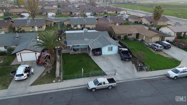 birds eye view of property with a residential view