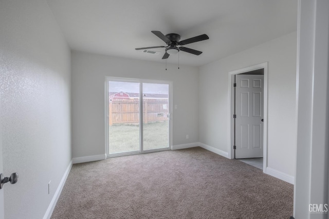 unfurnished room featuring a ceiling fan, visible vents, baseboards, and carpet flooring