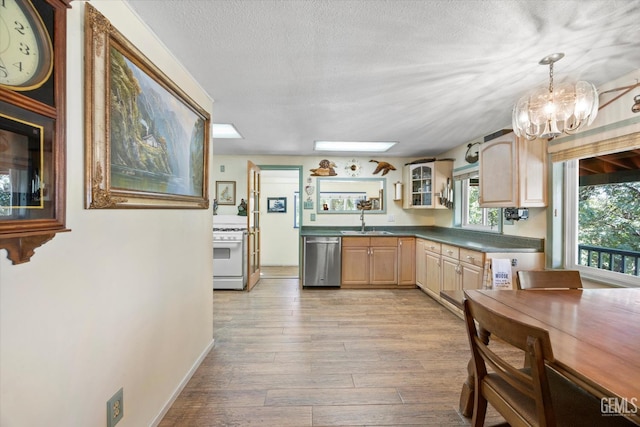 45071 Forest Dr, Posey, CA 93260 - kitchen featuring stainless steel dishwasher, white range with gas stovetop, light wood-style floors, glass insert cabinets, and light brown cabinetry