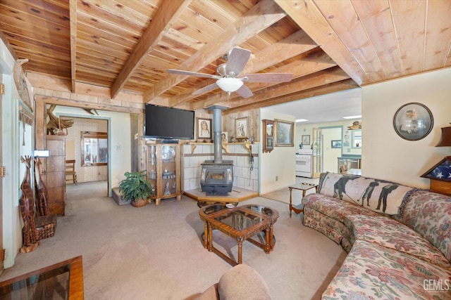 45071 Forest Dr, Posey, CA 93260 - living room featuring a wooden ceiling with exposed beams, a wood stove, carpet flooring, and ceiling fan