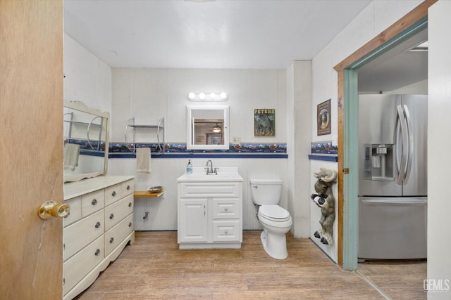 45071 Forest Dr, Posey, CA 93260 - bathroom with vanity, wood finished floors, and wainscoting
