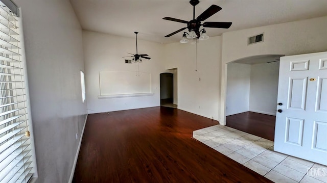 unfurnished room with ceiling fan and light hardwood / wood-style flooring