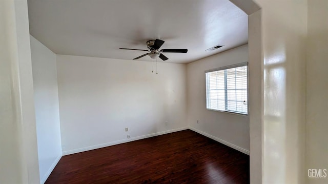 unfurnished room featuring ceiling fan and dark hardwood / wood-style floors