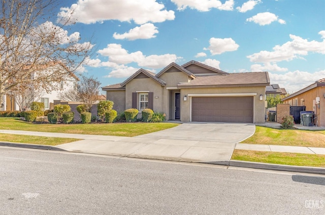 view of front of property with a garage and a front lawn