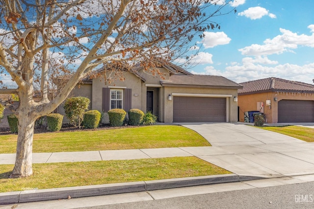 view of front of property featuring a garage and a front lawn