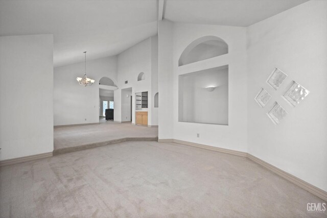 7601 Live Oak Way, Bakersfield, CA 93308 - spare room with carpet floors, a chandelier, baseboards, and high vaulted ceiling