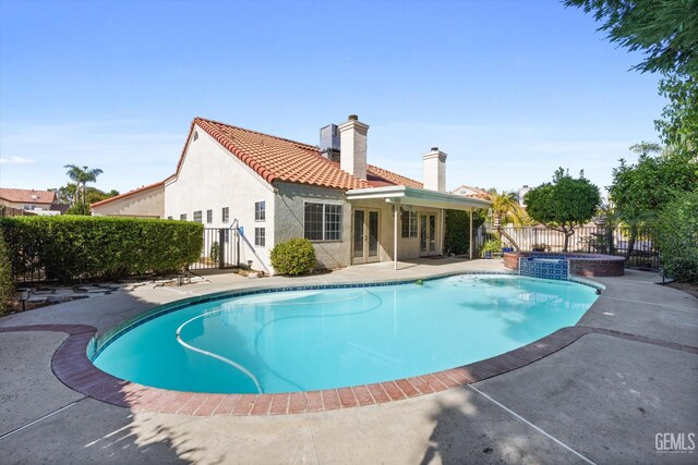 7601 Live Oak Way, Bakersfield, CA 93308 - view of pool with french doors, a patio, and a pool with connected hot tub
