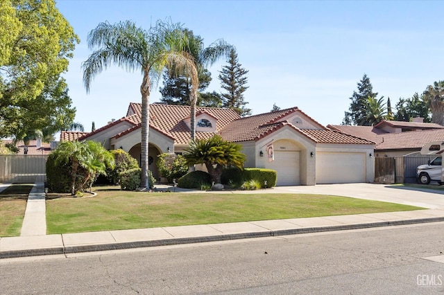 7601 Live Oak Way, Bakersfield, CA 93308 - mediterranean / spanish-style home featuring a garage, stucco siding, a tiled roof, and concrete driveway