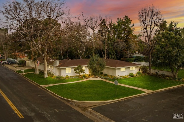 view of front of house featuring a lawn