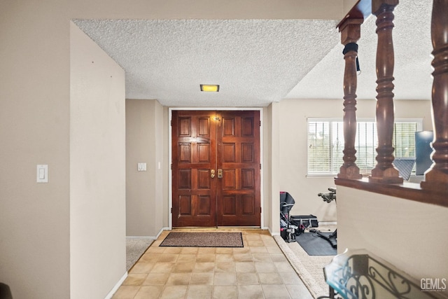 entryway featuring a textured ceiling