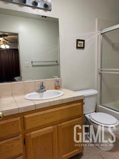 10011 Grand View Summit Dr, Bakersfield, CA 93311 - bathroom with vanity, tile patterned flooring, shower / bath combination with glass door, and a ceiling fan