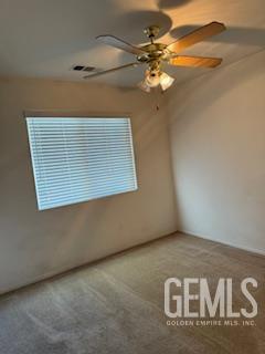 10011 Grand View Summit Dr, Bakersfield, CA 93311 - carpeted empty room with a ceiling fan