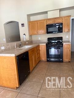 10011 Grand View Summit Dr, Bakersfield, CA 93311 - kitchen featuring black appliances, light tile patterned floors, light countertops, and a peninsula