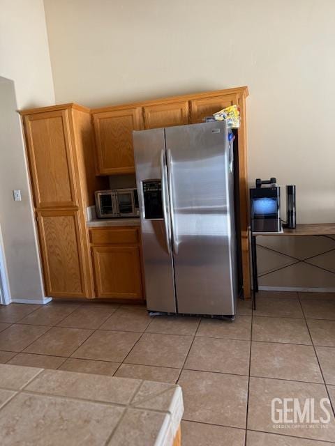 10011 Grand View Summit Dr, Bakersfield, CA 93311 - kitchen featuring stainless steel fridge with ice dispenser and light tile patterned flooring
