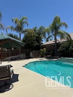 10011 Grand View Summit Dr, Bakersfield, CA 93311 - view of pool with a patio and a fenced backyard