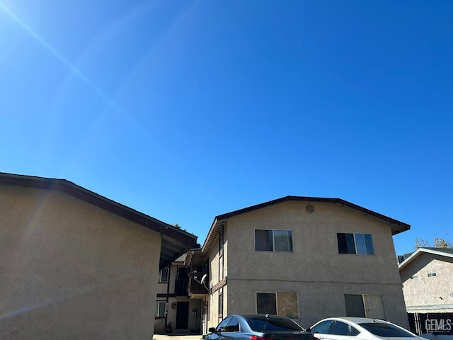 view of side of home featuring stucco siding