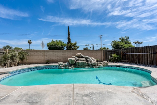 1317 Canyon Ct, Bakersfield, CA 93307 - view of swimming pool featuring a fenced backyard