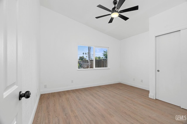 1317 Canyon Ct, Bakersfield, CA 93307 - unfurnished bedroom featuring light wood-style flooring, lofted ceiling, baseboards, and a ceiling fan
