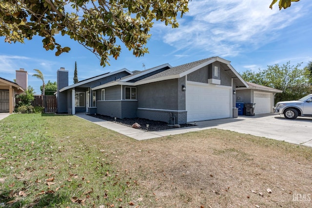 1317 Canyon Ct, Bakersfield, CA 93307 - view of side of home with a garage, brick siding, concrete driveway, stucco siding, and a chimney