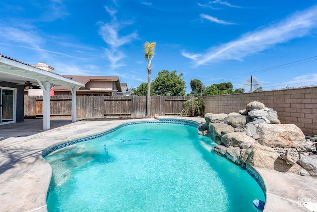 1317 Canyon Ct, Bakersfield, CA 93307 - view of pool featuring a patio area, a fenced backyard, and a ceiling fan