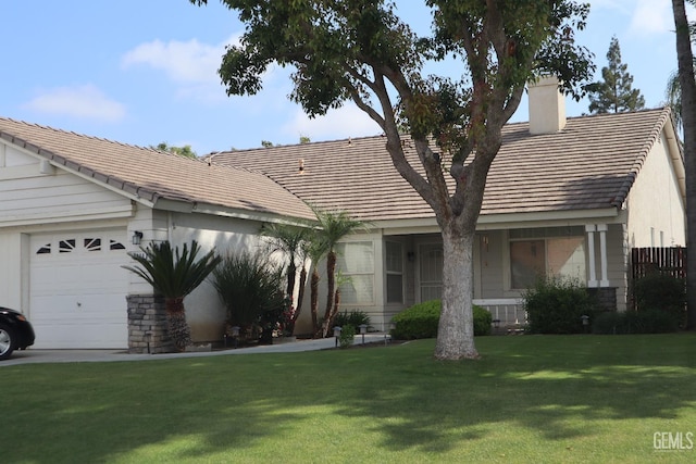 ranch-style home with stone siding, a chimney, a tiled roof, an attached garage, and a front lawn