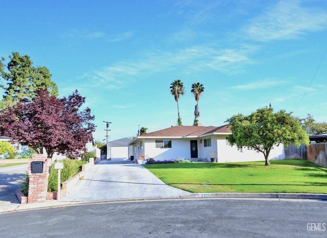 5205 Lansdale Dr, Bakersfield, CA 93306 - ranch-style house with fence, stucco siding, a front yard, and driveway