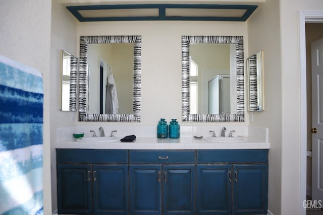 full bath with double vanity and a sink