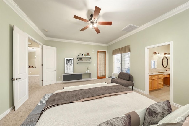 carpeted bedroom with ceiling fan, ornamental molding, and ensuite bathroom