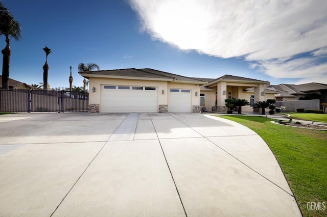 view of front of home featuring a garage and a front lawn