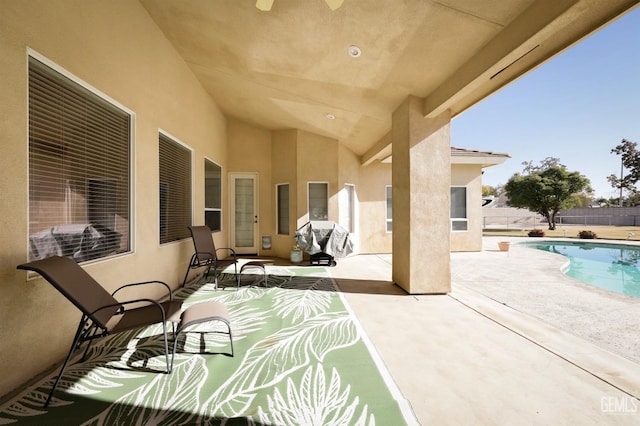 view of patio / terrace with a fenced in pool