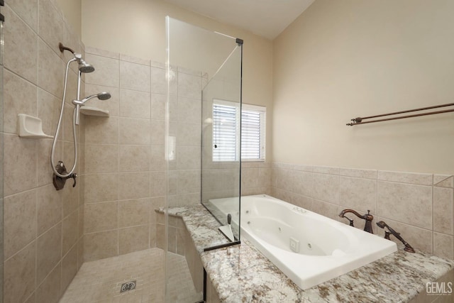 bathroom with separate shower and tub