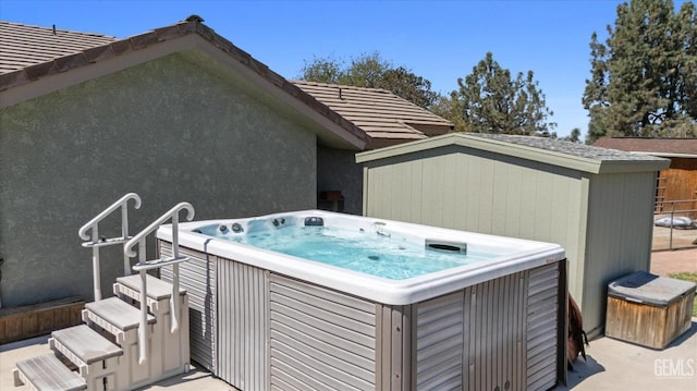 exterior space with a hot tub