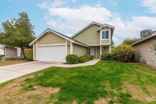 view of front of home with a front yard, central AC unit, and a garage