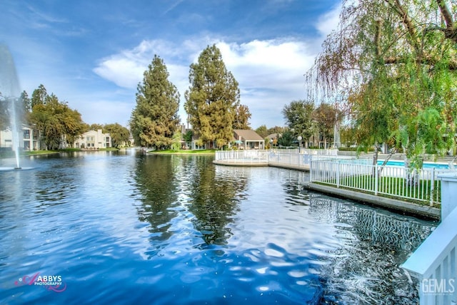 view of water feature with fence