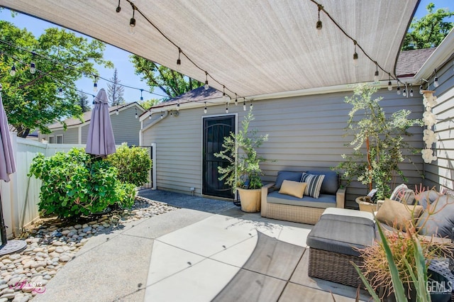 view of patio featuring fence